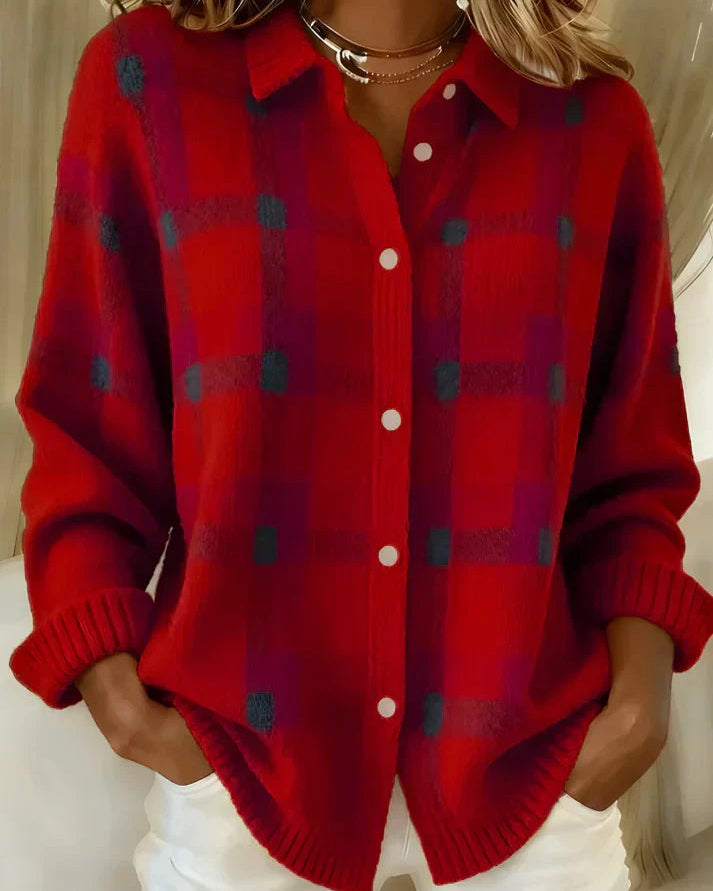 Side profile of a woman wearing the orange Sable relaxed fit cardigan, showcasing its loose drape.