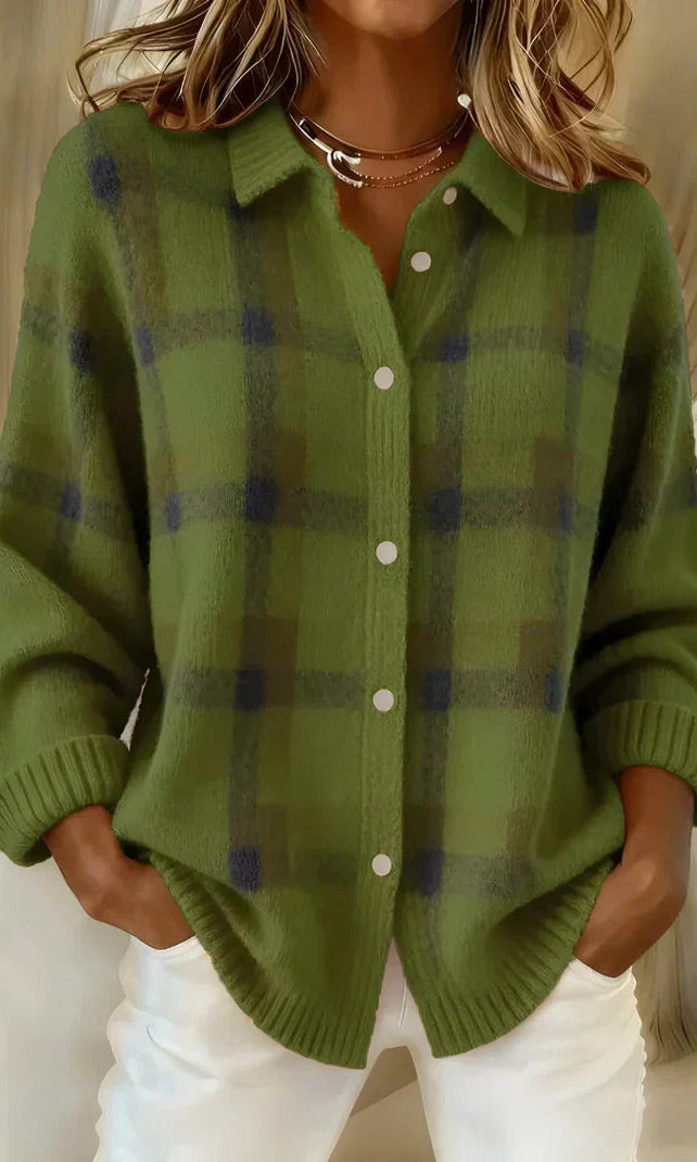 Close-up detail of the button closure on the orange Sable relaxed fit cardigan.