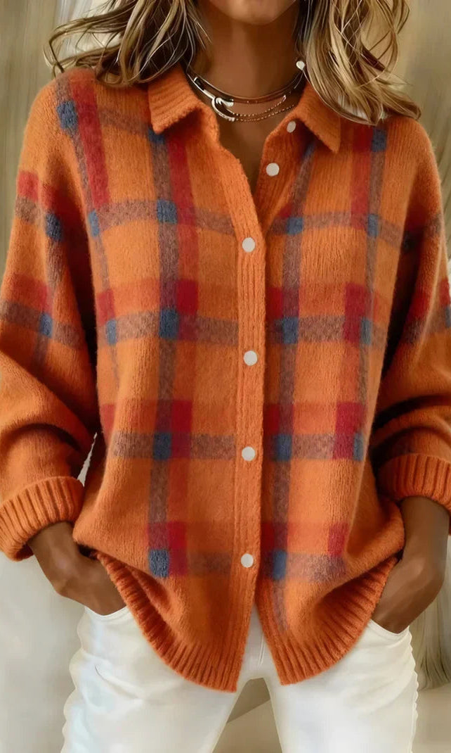 A stack of Sable relaxed fit cardigans in various colors, neatly folded.