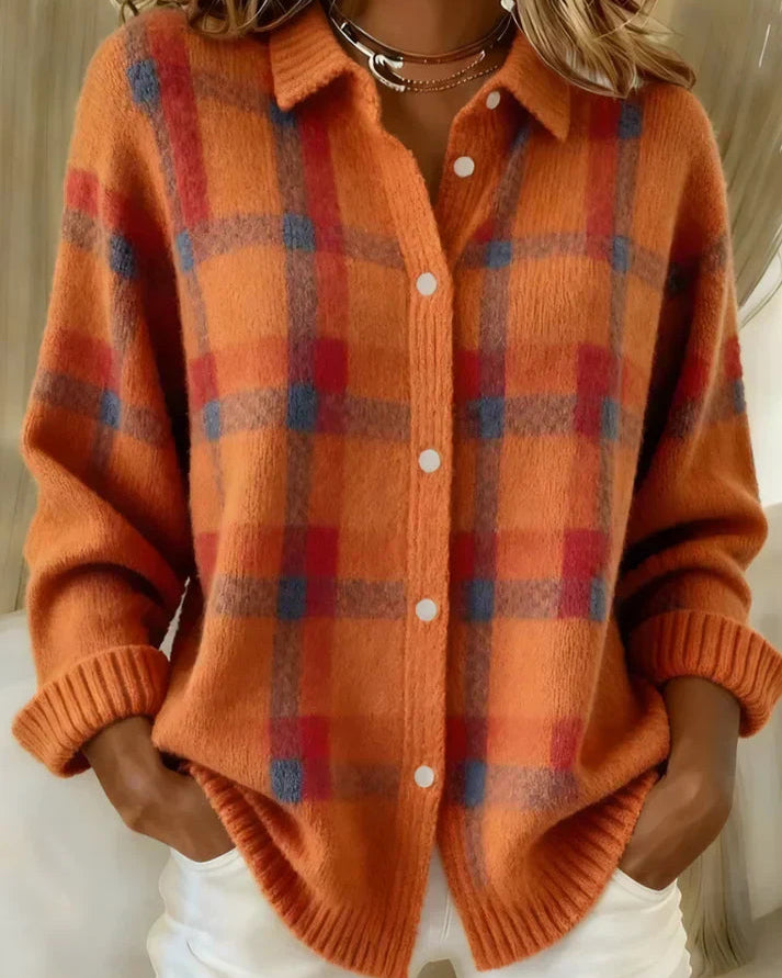 A stack of Sable relaxed fit cardigans in various colors, neatly folded.