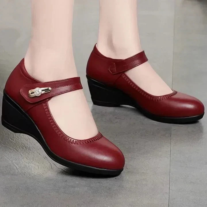 Side-by-side comparison of the red, black, and beige Elara elegant mid-heel shoes, displaying color options.