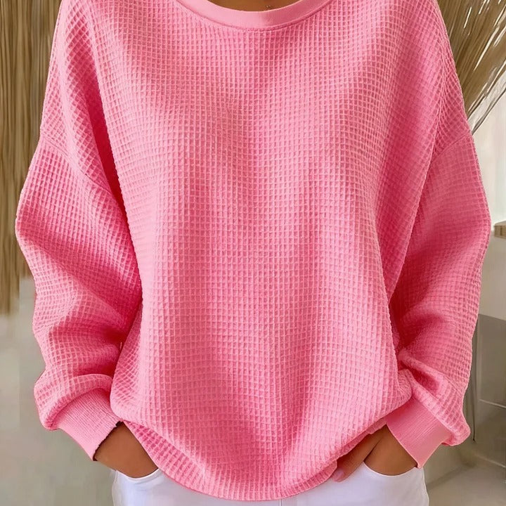Diverse group of women wearing the Soraya knitted wide collar sweater in various colors, showcasing versatility.