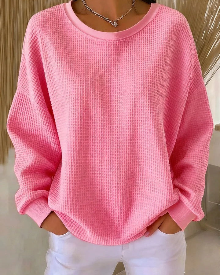 Diverse group of women wearing the Soraya knitted wide collar sweater in various colors, showcasing versatility.