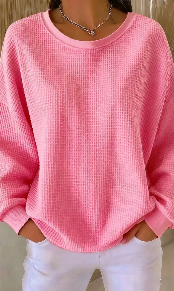 Diverse group of women wearing the Soraya knitted wide collar sweater in various colors, showcasing versatility.