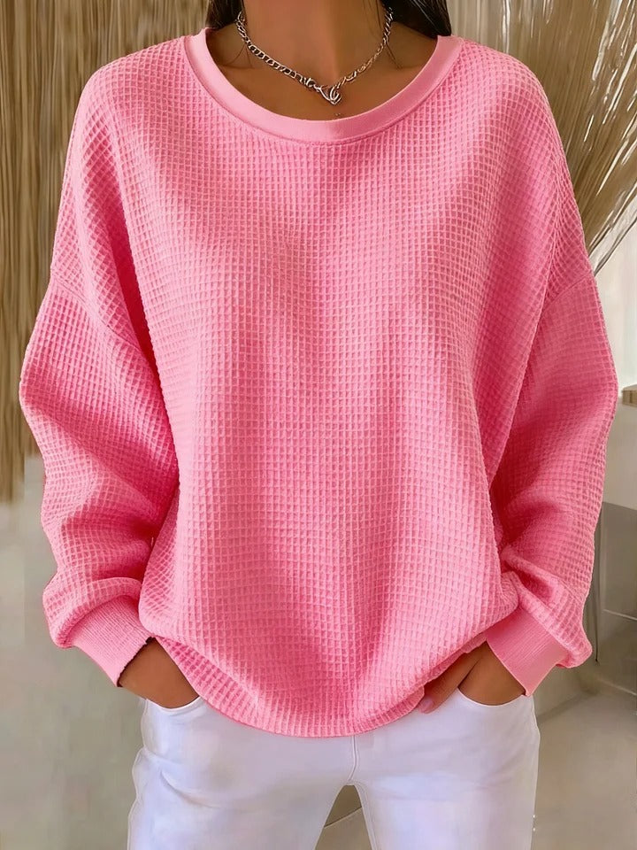 Diverse group of women wearing the Soraya knitted wide collar sweater in various colors, showcasing versatility.