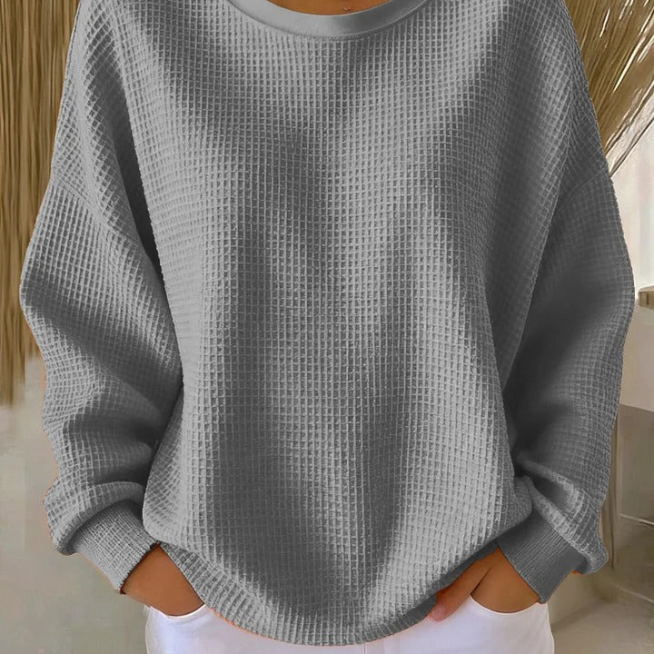 Close-up detail of the wide collar and knit pattern on the Soraya sweater, emphasizing its quality.