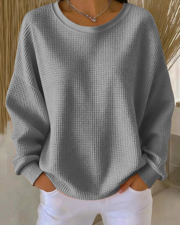 Close-up detail of the wide collar and knit pattern on the Soraya sweater, emphasizing its quality.