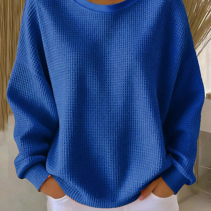 Back view of the Soraya knitted wide collar sweater, showing the simple hem and overall relaxed silhouette.