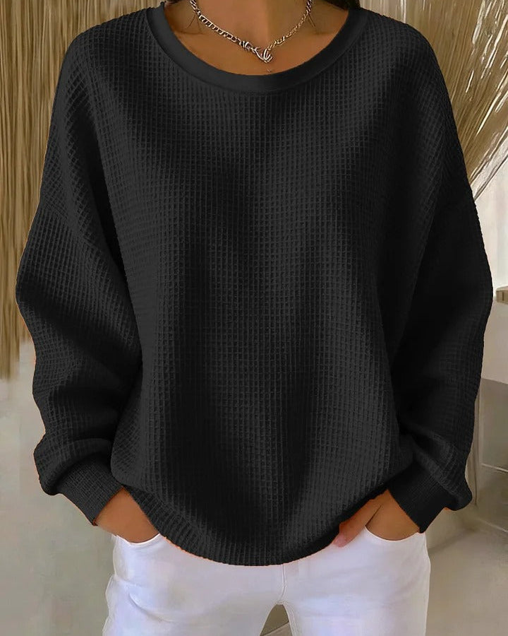 Detailed shot of the sleeve cuff and hem of the Soraya knitted wide collar sweater, showcasing the finish.