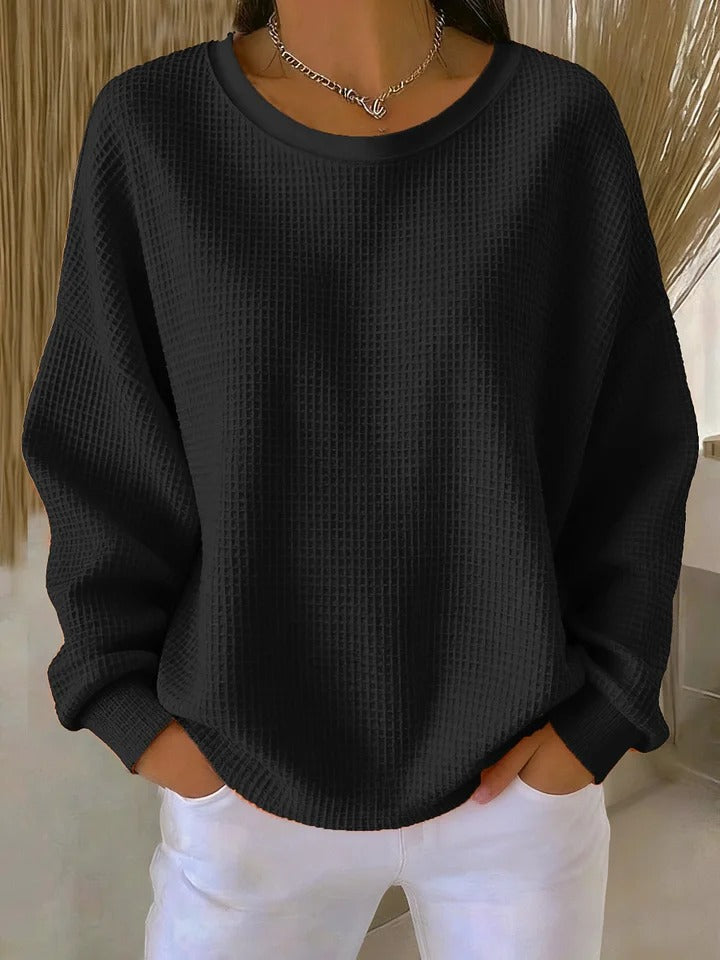 Detailed shot of the sleeve cuff and hem of the Soraya knitted wide collar sweater, showcasing the finish.