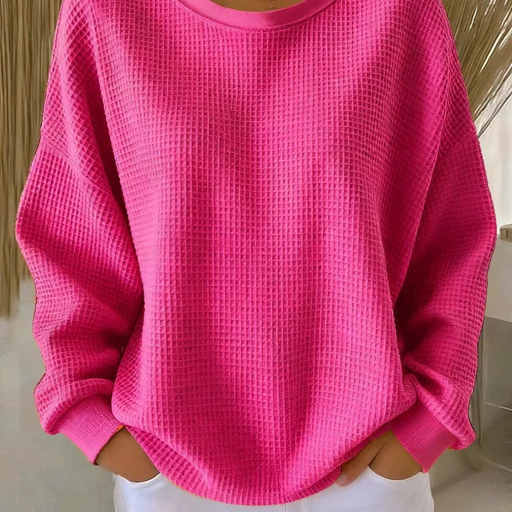 Close-up of the fabric texture of the Soraya knitted wide collar sweater, highlighting the quality of the knit.