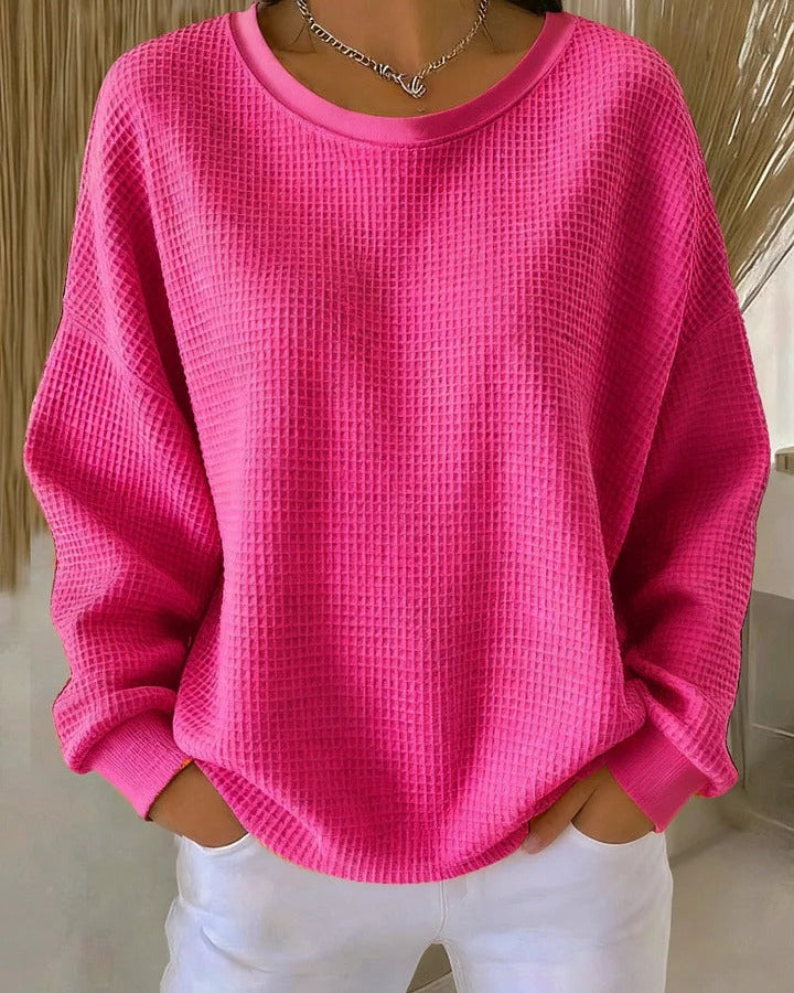Close-up of the fabric texture of the Soraya knitted wide collar sweater, highlighting the quality of the knit.