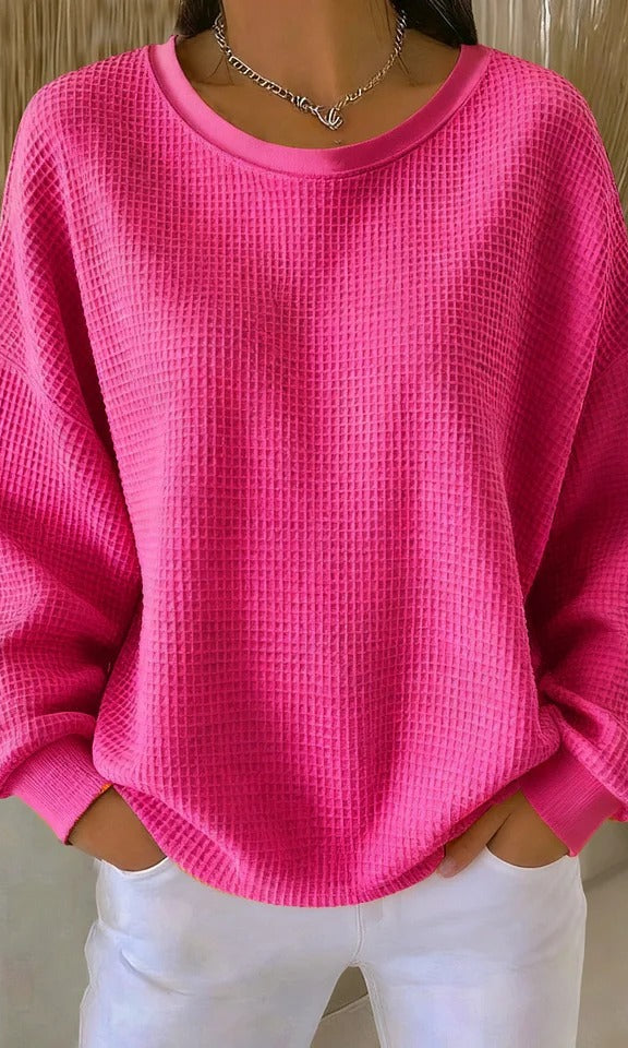 Close-up of the fabric texture of the Soraya knitted wide collar sweater, highlighting the quality of the knit.