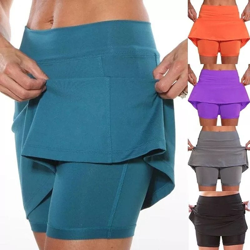 Woman walking outdoors in a navy blue active skort, perfect for casual activities and daily wear.