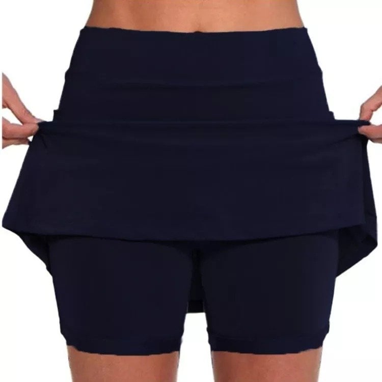 Texture detail of the soft fabric on the orange active skort, ensuring all-day comfort.