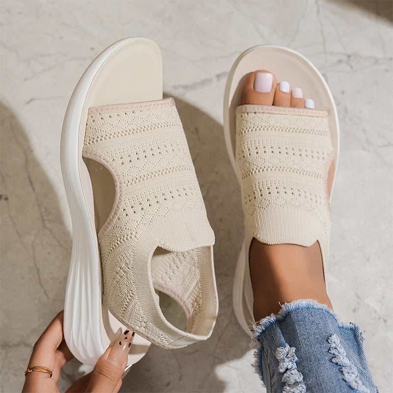 Detailed view of the lightweight sole on beige breathable platform sandals, showing its subtle height.