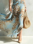 Full-length view of the lightweight fabric of an animal print maxi dress, designed for airy movement and elegance.