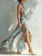 Close-up detail of the twisted halter neckline on a sophisticated animal print maxi dress, highlighting the pattern.