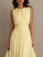 Lifestyle shot of the maxi dress in motion, illustrating how the light fabric floats and moves with the wearer.