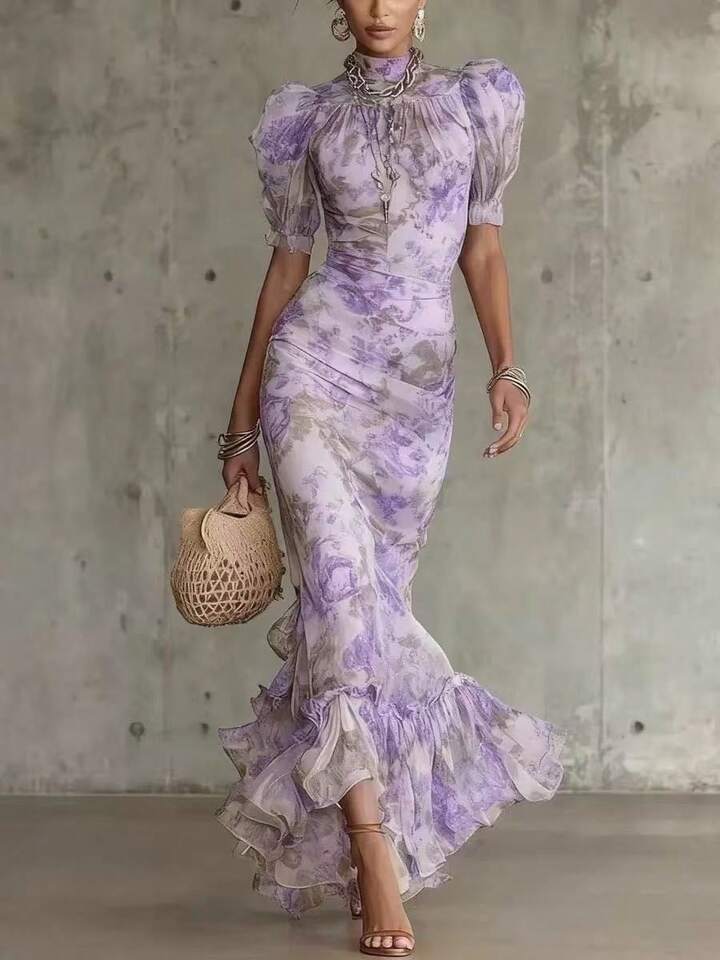 Lifestyle shot of a woman enjoying an outdoor garden event while wearing the charming floral maxi dress.