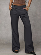 Detail shot of the high waistband on the Indira trousers, ensuring a flattering and secure fit.
