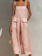 Folded view of the linen and cotton blend jumpsuit in various colors, illustrating its compact storage and material texture.