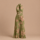 Side profile of the elegant wide-leg women's jumpsuit, showcasing its flowing silhouette and high waist.