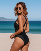 Rear view of the navy one-piece swimsuit, highlighting the back design and comfortable fit for swimming.