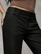 Close-up of the fabric texture on the caramel Indira trousers, emphasizing its airy feel and quality.