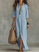 Detail shot of the button-front design on the green long sleeve maxi dress, showing adjustability and style.