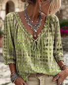 Orange polka dot blouse, a full shot displaying its flattering length and overall shape.