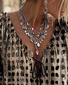 Pink boho print blouse, close-up on the hemline, illustrating the quality finish of the garment.