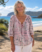 Pink boho print blouse, showcasing the relaxed silhouette and comfortable three-quarter sleeves.