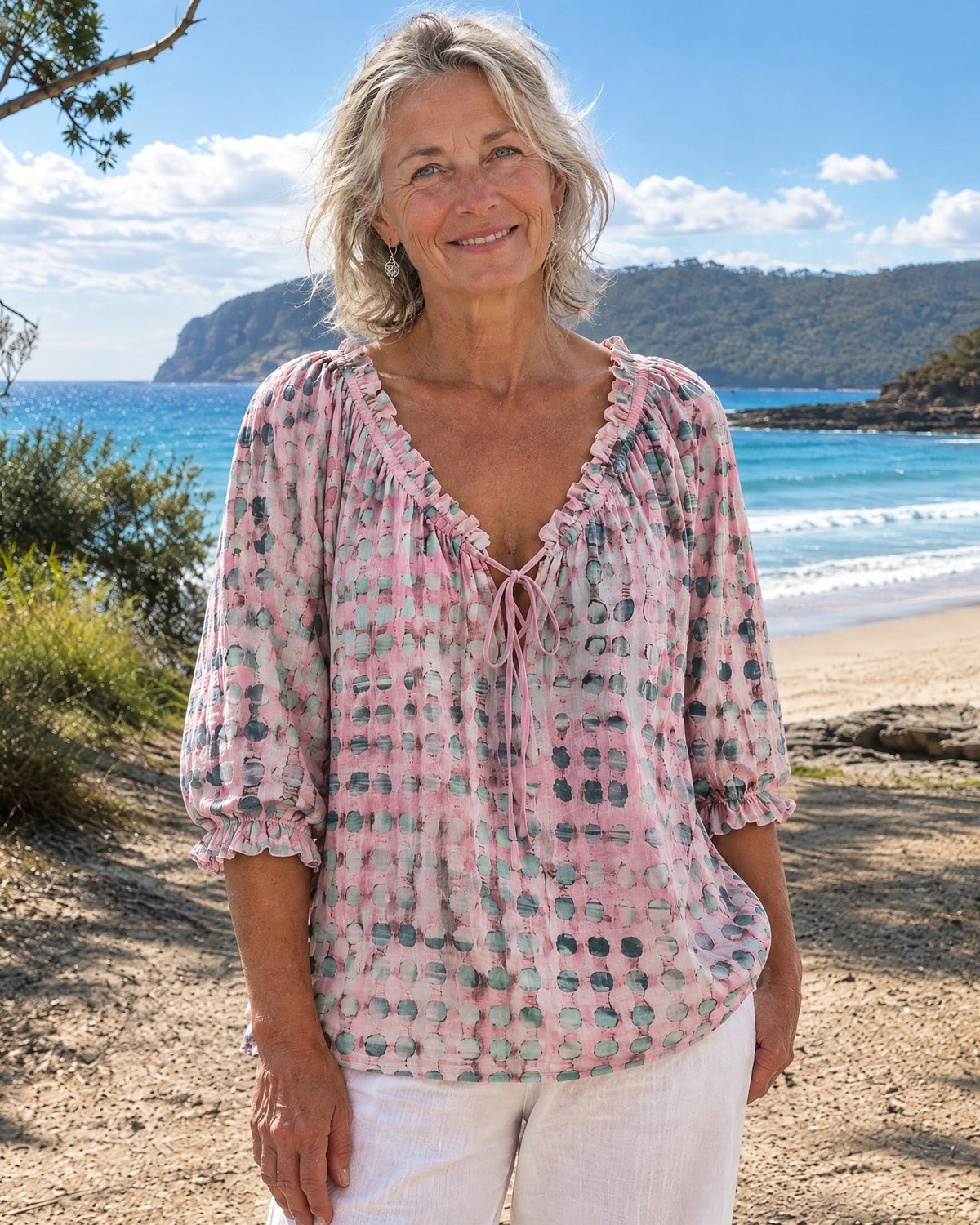 Pink boho print blouse, showcasing the relaxed silhouette and comfortable three-quarter sleeves.