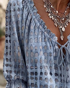 Brown Fiona blouse, front view with arms slightly raised, demonstrating freedom of movement.