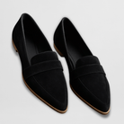 Overhead shot of a pair of grey suede loafers, highlighting the comfortable, smooth leather-look interior.