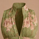 Close-up detail of the V-neckline and intricate pleating on the sleeveless women's jumpsuit.
