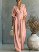 Olive green jumpsuit styled for a chic daytime appearance, perfect for a sophisticated look.