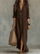 Side profile of a model wearing the white long sleeve maxi dress, demonstrating the elegant maxi length.