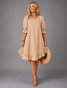 Back view of the Nora versatile midi dress, demonstrating the flow and movement of the design.