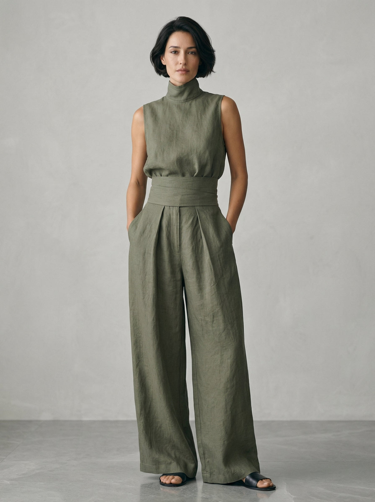Close-up on the wide fixed waistband of the light blue trousers, illustrating its secure and flattering placement.