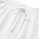 Rear view of women's white capri trousers, showing the smooth fit across the back.