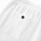 Detailed close-up of the natural texture of the cotton-linen blend in the capri trousers.