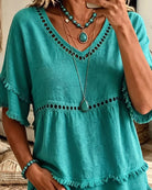 Close-up texture of the soft fabric on the versatile blouse, perfect for adding everyday charm.