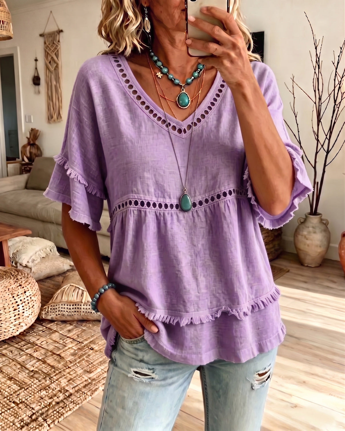 Lifestyle image of a woman enjoying a leisurely weekend outing in her comfortable frill blouse.
