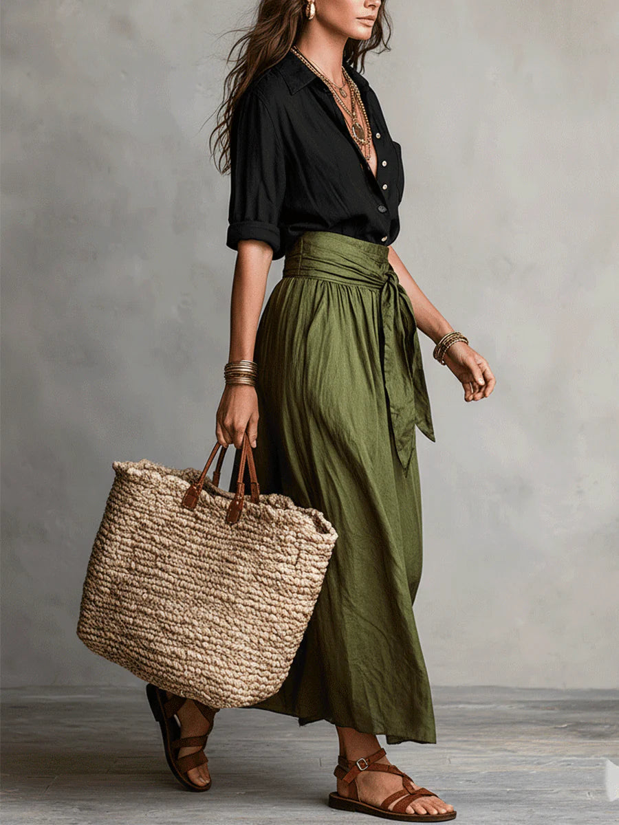 Close-up of the adjustable tie-front belt on the elegant high-waisted midi skirt, showcasing fabric texture.