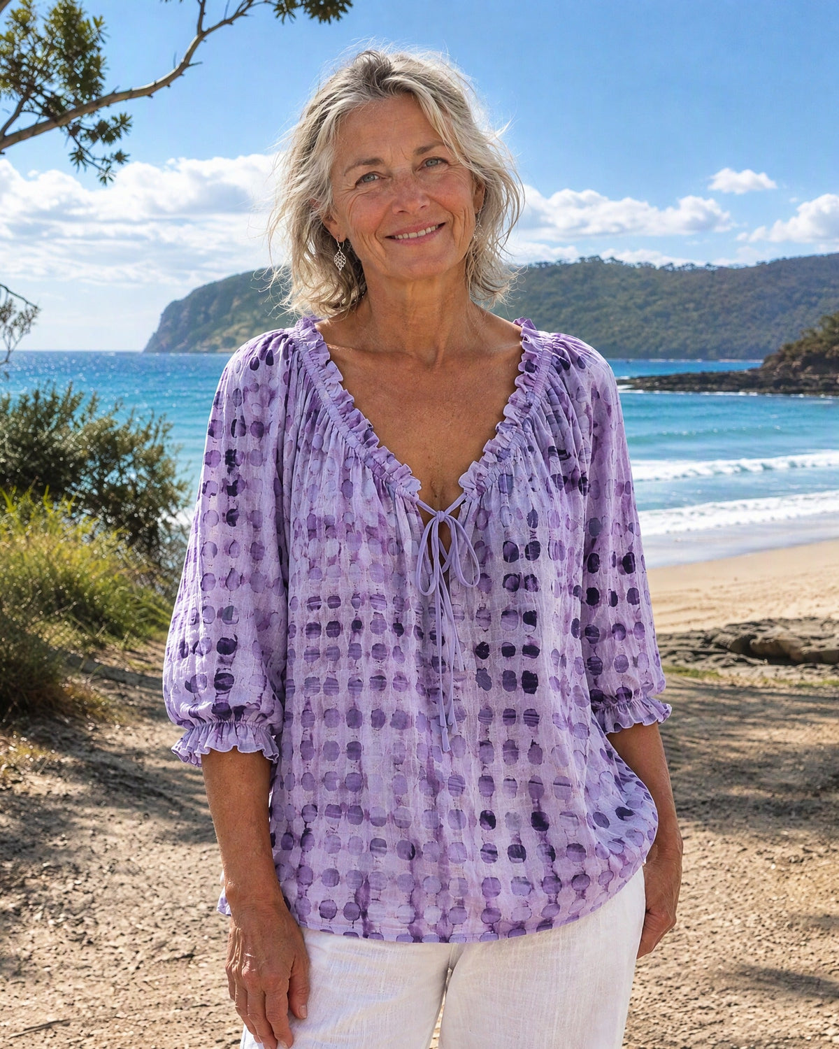 Lilac Fiona blouse styled casually with light-wash jeans, perfect for an effortless summer look.