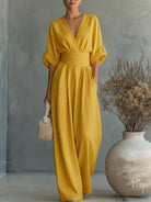 Model wearing a light green jumpsuit, demonstrating freedom of movement and versatile styling.