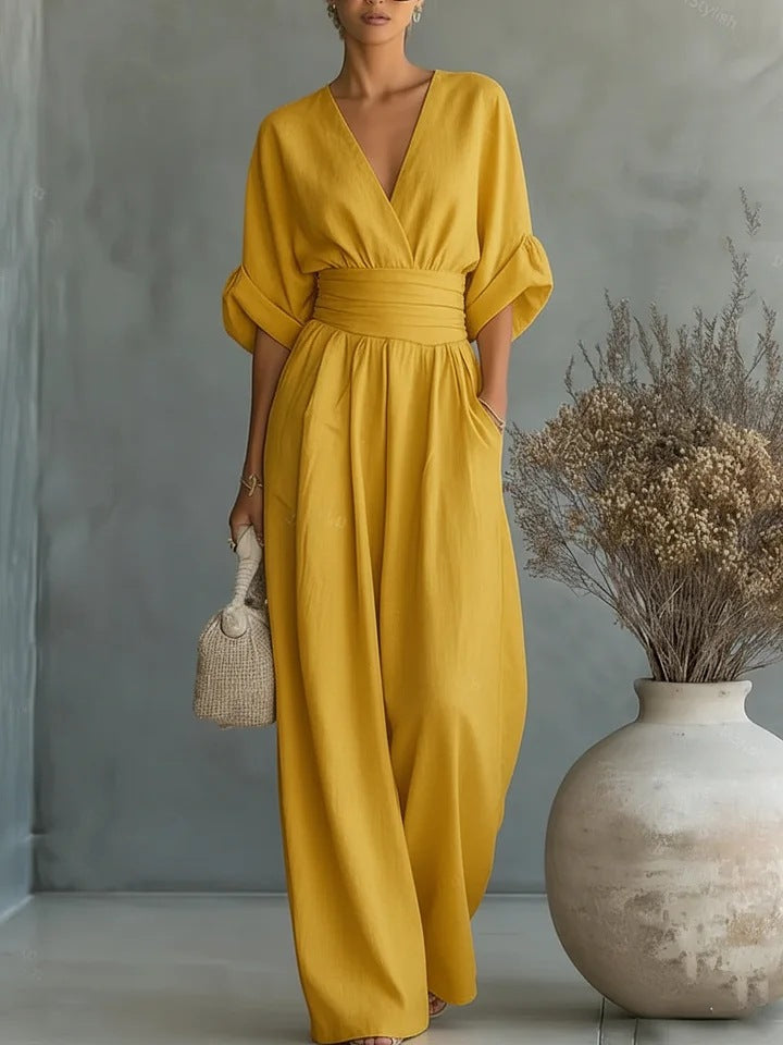 Model wearing a light green jumpsuit, demonstrating freedom of movement and versatile styling.
