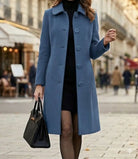 Lifestyle image of the Alessia classic coat paired with a scarf, illustrating its versatility for cooler weather and sophisticated layering.